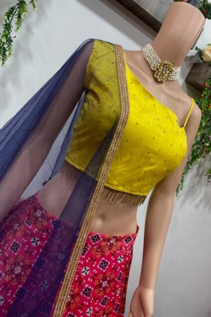 Striking Single Shoulder Crop Top Lehenga Choli In Pink & Yellow Color Combination
