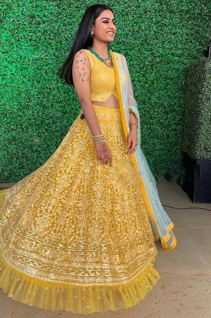 Yellow Color Charming Lehenga Choli On Net Ruffle With Embroidery Work