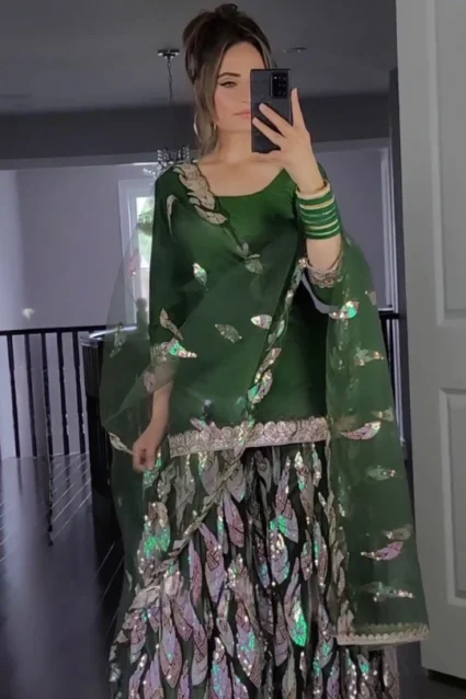 Elegant Green Georgette Exquisitely Embroidered Sharara Suit. Elegant Green Georgette Exquisitely Embroidered Sharara Suit.