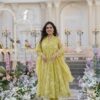 Image of Faded yellow organza suit set Yellow Suit Set displayed with matching accessories and styling for ethnic wear collection.