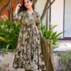 Image of kaleidoscope elegance green suit set Green Suit Set displayed with matching accessories and styling for ethnic wear collection.