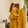 Image of Jassica Mustard Sharara Set Mustard Embroidered Kurta with Flared Sharara and Dupatta displayed with matching accessories and styling for ethnic wear collection.