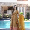 Image of Gauri mustard embroidered suit set Mustard Suit Set displayed with matching accessories and styling for ethnic wear collection.
