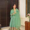 Image of Janitha Green Suit Set Light Green Straight-Cut Suit with Subtle Embroidery and Dupatta displayed with matching accessories and styling for ethnic wear collection.