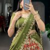 Rust orange kalamkari design detail on the lehenga's dupatta
