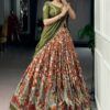 Close-up of rust orange kalamkari silk fabric on this half saree