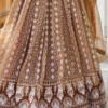 Detailed view of the sequence work design on the Brown Sangeet Lehenga Choli, featuring intricate...
