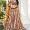 Close-up shot of the thread embroidered sequence work on the Brown Sangeet Lehenga Choli, showcas...