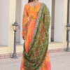 Model wearing Orange Russian Silk Digital Floral Printed Anarkali Gown with statement jewelry for...