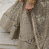 Delicate sequence work close-up on ivory net lehenga choli reveals the intricate craftsmanship th...