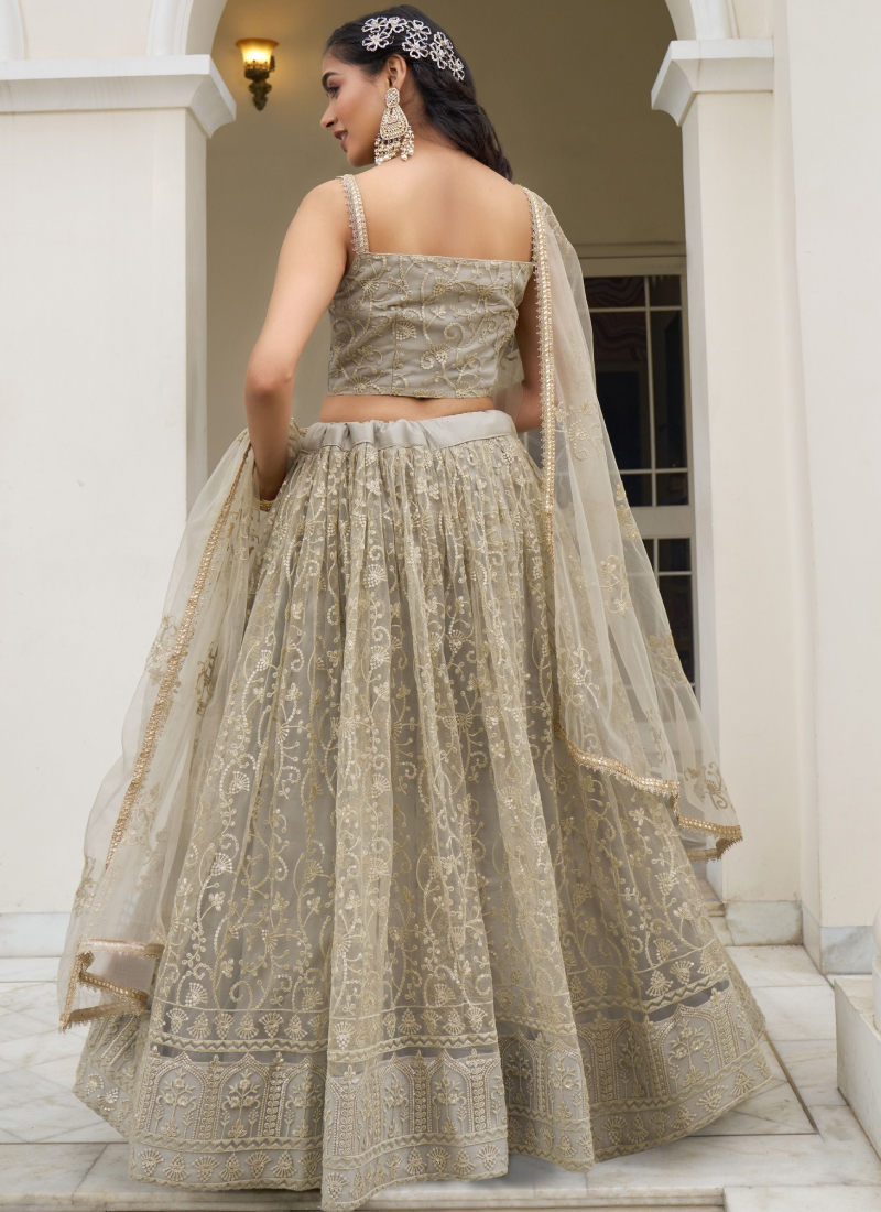 Ivory Net Lehenga Choli with Sequence Work - Reception Wear Ivory Net Lehenga Choli with Sequence Work - Reception Wear