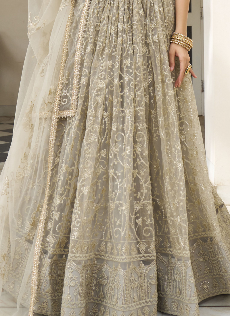 Ivory Net Lehenga Choli with Sequence Work - Reception Wear Ivory Net Lehenga Choli with Sequence Work - Reception Wear