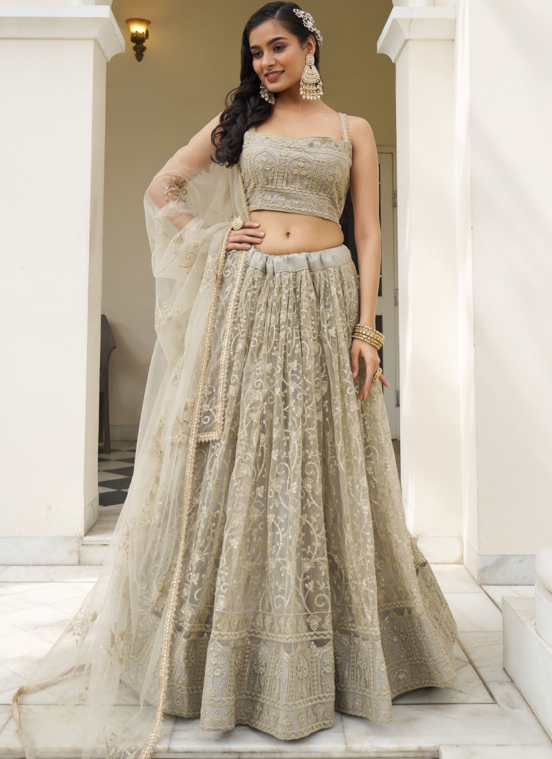 Ivory Net Lehenga Choli with Sequence Work - Reception Wear Ivory Net Lehenga Choli with Sequence Work - Reception Wear