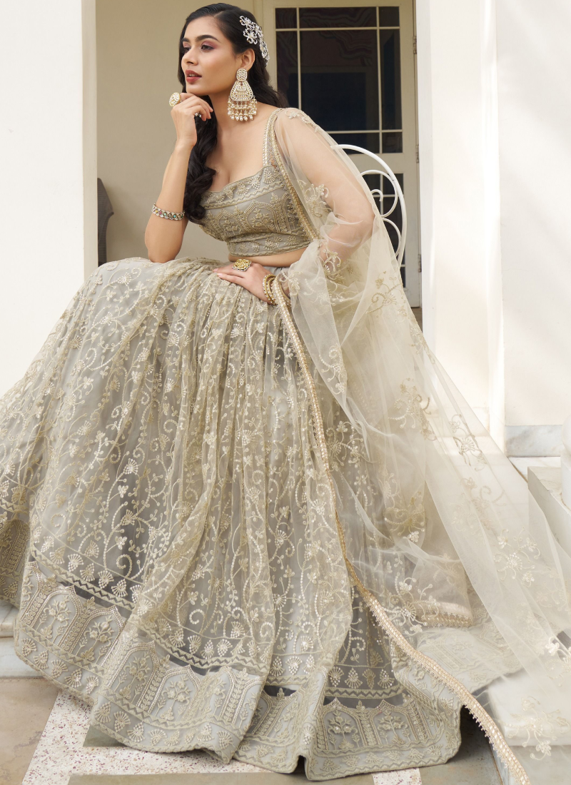 Ivory Net Lehenga Choli with Sequence Work - Reception Wear Ivory Net Lehenga Choli with Sequence Work - Reception Wear
