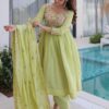 Pista green anarkali pant suit front view with intricate thread work details shining bright on th...