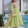 Pista Green Chanderi Anarkali Pant Suit Styled with Traditional Jewelry and Shoes.