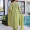 Close-up of pista green thread work design on the chanderi anarkali pant suit.