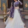Purple silk dupatta flowing elegantly behind the model