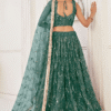 Closer look at intricate mirror work on green lehenga