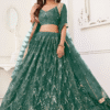 Stylish woman wearing green mirror work lehenga and choli
