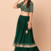 The front view of this stunning green mehendi lehenga choli features a beautiful zari sequence em...