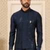 Nehru jacket with art silk bottom for men showcased in a close-up view highlighting intricate emb...