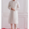 White Silk Kurta Paired with Pista Green Jacket in Traditional Indian Style, Ideal for Groom or B...
