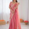 Peach Lace Border Saree Back View with Blouse, Emphasizing the Flowy Silhouette and Vibrant Color...