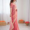 Up-Close Peek at the Delicate Lace Border on this Gorgeous Peach Saree, Perfectly Accented by Mat...