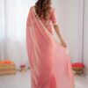 A Beautiful Peach Hued Saree with Intricate Lace Border Accents, Paired with a Matching Blouse fo...