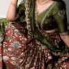 Closer look at the rust orange kalamkari silk embroidery on this lehenga