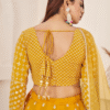 Close-up Shot Highlights the Exquisite Thread Embroidery Work on the Lehenga Fabric of This Lovel...