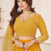 Beautifully Styled Model Wears the Vibrant Yellow Haldi Lehenga Choli with Thread Embroidery Work...